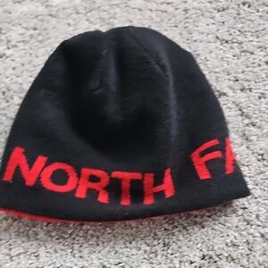 The North Face Black Beanie with Red Lettering